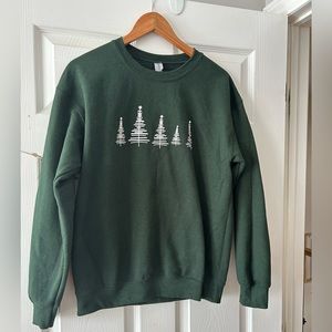 Green sweatshirt with tree design